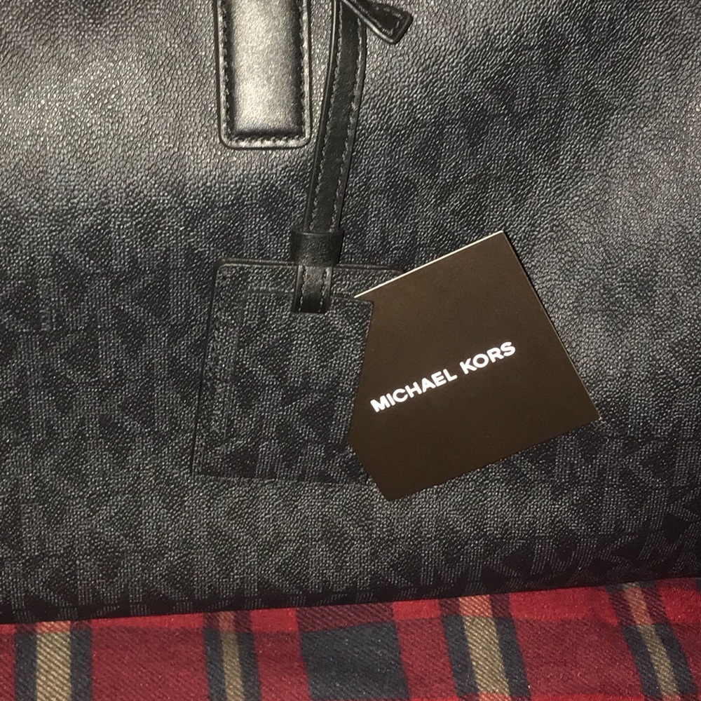 Jet black Michael kors duffle bag